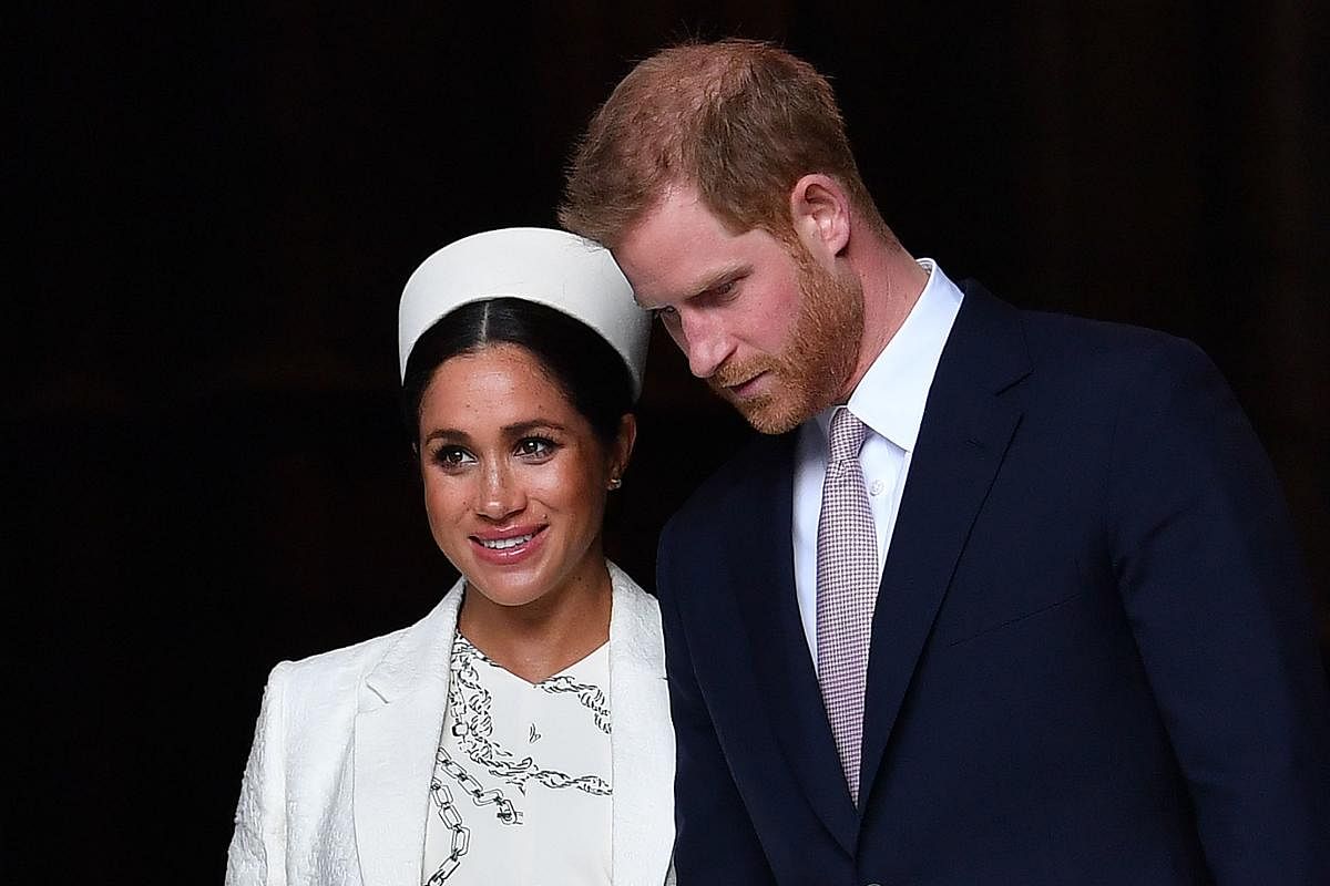 Britain's Prince Harry, Duke of Sussex (R) and Meghan, Duchess of Sussex (AFP Photo)