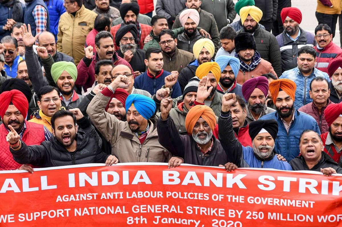 Bank employees shout slogans during a nationwide general strike called by trade unions. (AFP File Photo)
