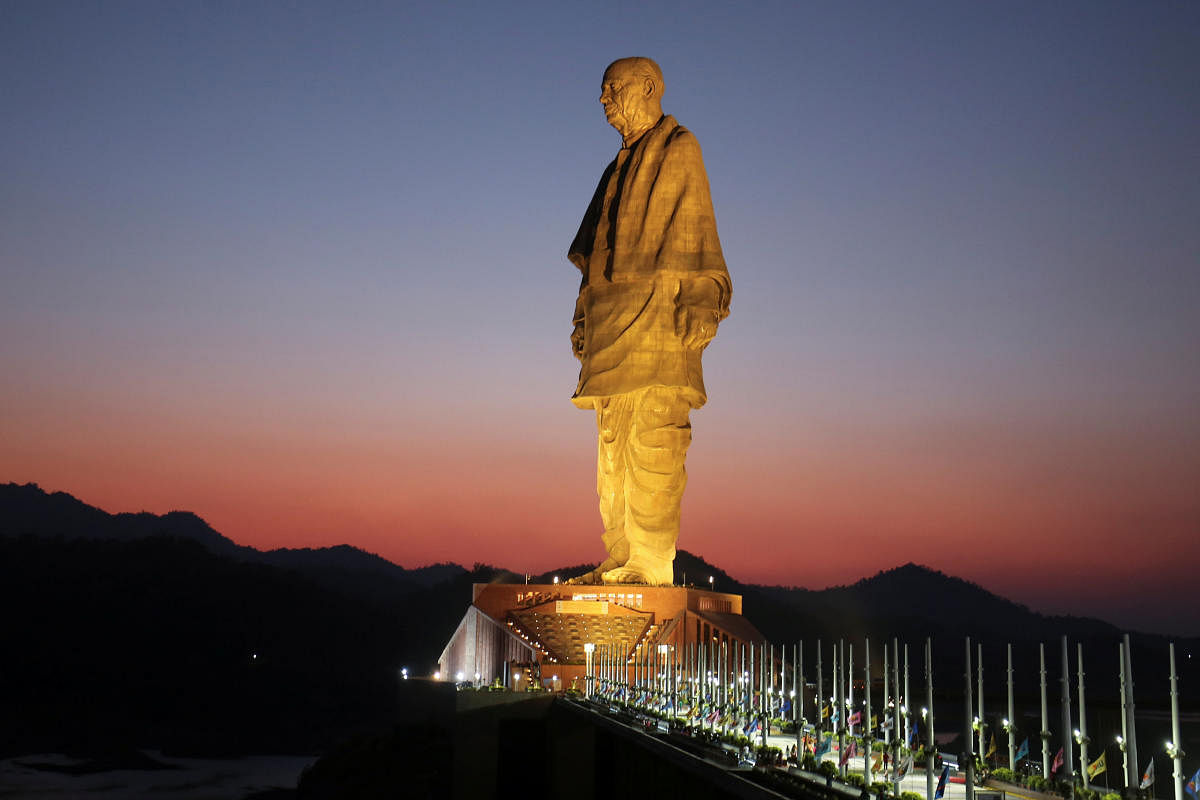 The towering 182-metre statue is at the Sardar Sarovar Dam in Kavadia, Gujarat. (PTI Photo)