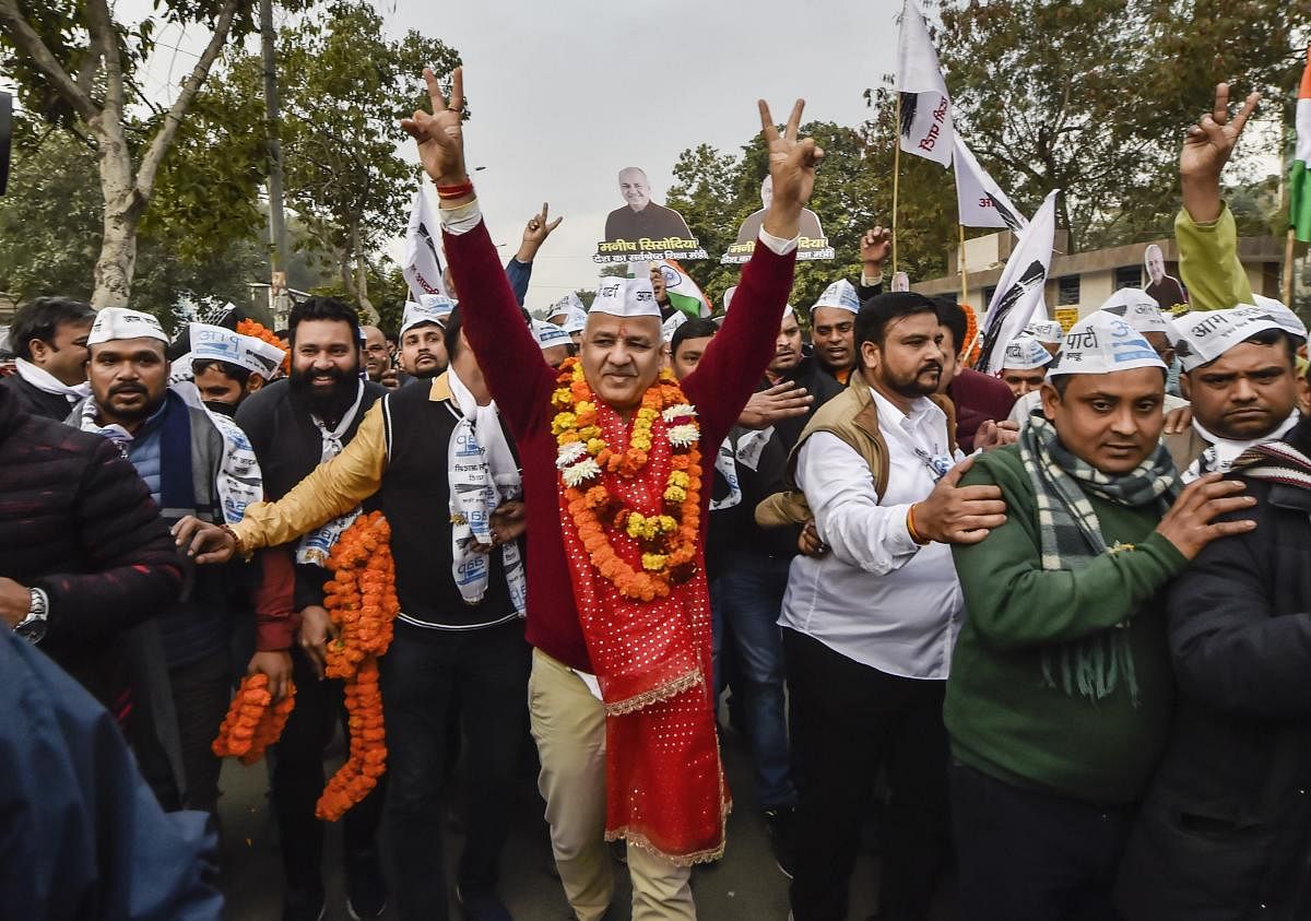 AAP leader and Delhi deputy CM Manish Sisodia along with supporters on his way to file nomination papers from Patparganj Assembly constituency, in New Delhi. (PTI Photo)