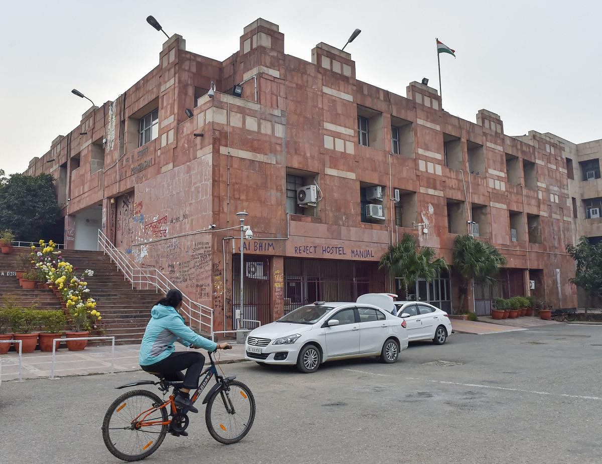 Delhi police vehicles are seen parked at the admin block of JNU Campus in New Delhi, Monday, Jan. 13, 2020. (PTI Photo)