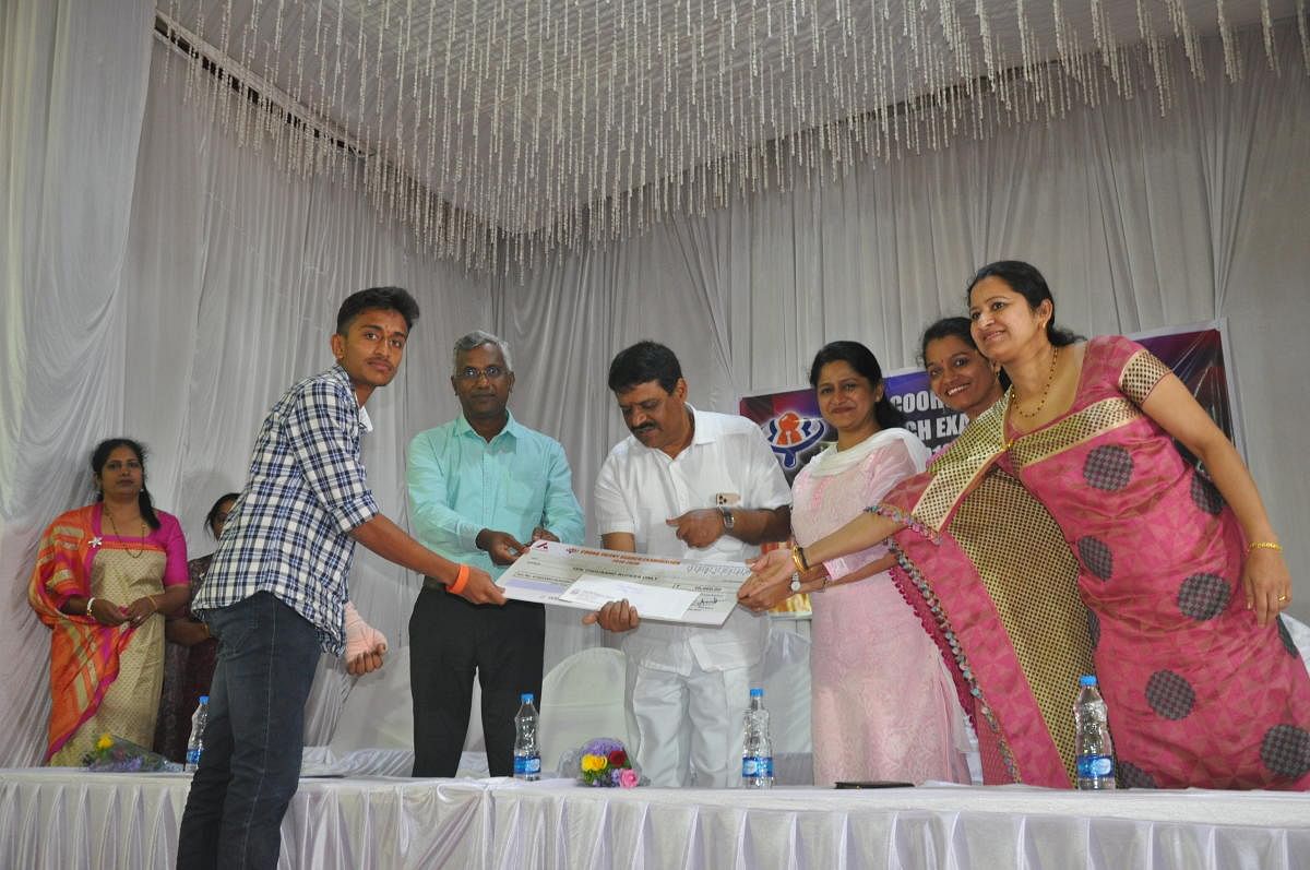 One of the topper receives scholarship during Coorg Talent Search Examination, in Madikeri.