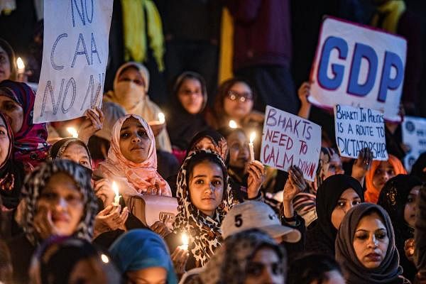 Muslim women take part in a candle light march in protest against the attack on Jamia students, CAA and NRC, at Jama Masjid, in New Delhi, Wednesday, Jan. 15, 2020. (PTI Photo/Arun Sharma)