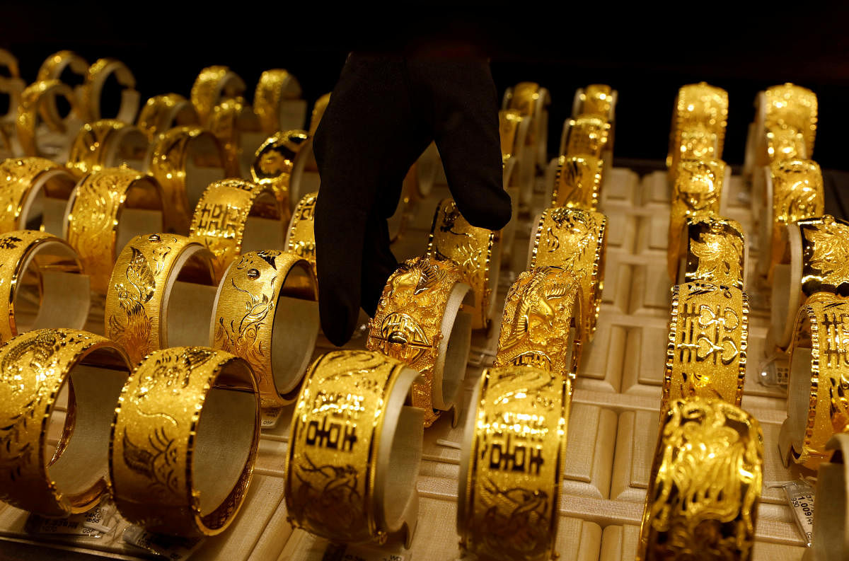 Weighing on gold prices, world stocks scaled record levels on Thursday as investors cheered the trade deal. Credit: Reuters