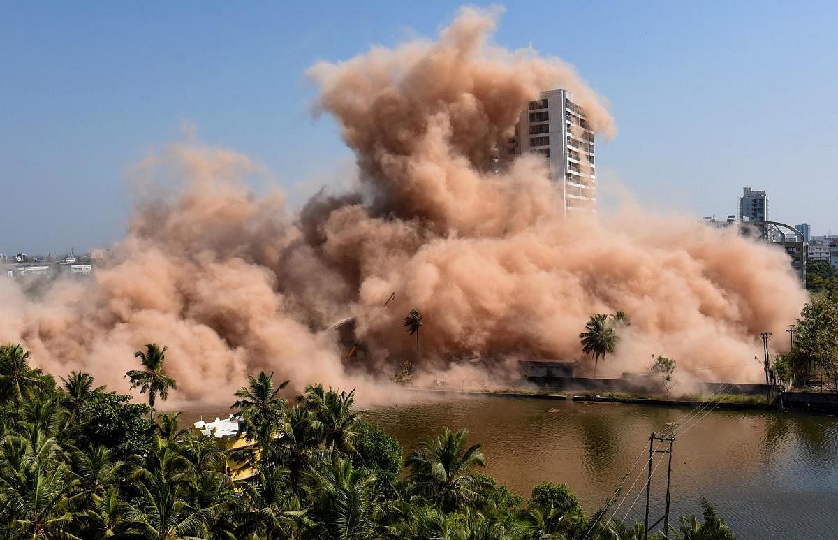 A view of Golden Kayaloram apartment, built in violation of Coastal Regulation Zone norms in Maradu Municipality, being demolished using controlled implosion, in Kochi. (PTI Photo)