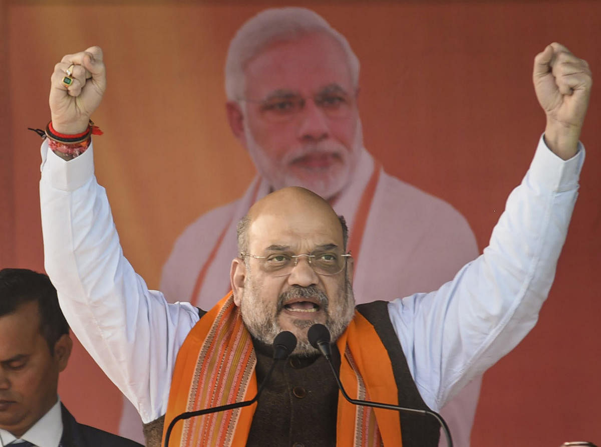 Home minister Amit Shah, who presided over the meeting for signing of the agreement announced a Rs. 600 package to Tripura government for their rehabilitation. (PTI photo)