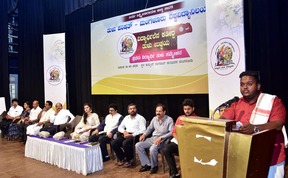 Student Harshith K speaks at the ‘Vidyarthilena Kadeerda Tulu Ucchaya’ at Town Hall in Mangaluru on Thursday.