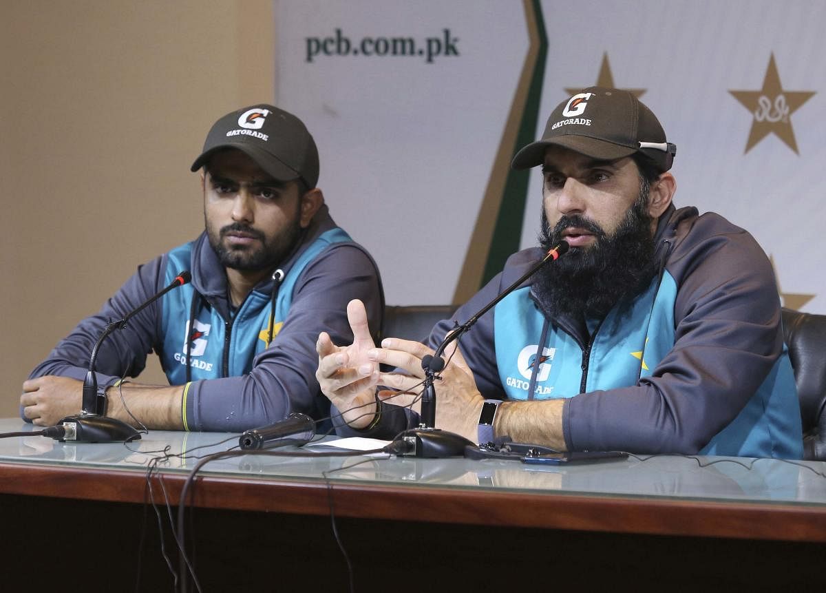 Pakistan chief selector Misbah-ul-Haq, right, addresses press conference with Twenty20 captain Babar Azam at Gaddafi Stadium in Lahore on Thursday, Jan. 16, 2020. (AP Photo)