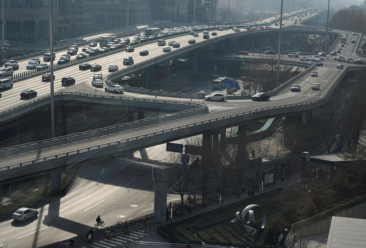A man cycles under the Guomao Bridge in Beijing, China January 17, 2020. (Reuters Photo)