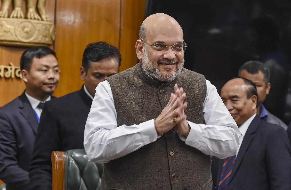 Union Home Minister Amit Shah during the signing of an agreement for a permanent settlement of 40,000 displaced Bru tribals in Tripura. (PTI PHOTO)