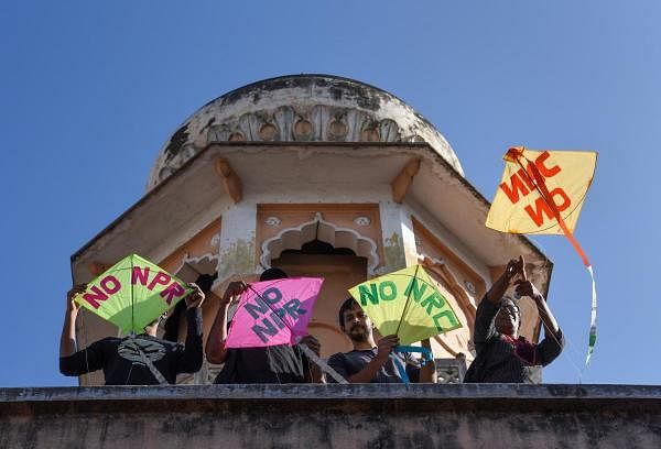 Protesters fly kites bearing anti-CAA/NRC slogans during a protest, in Bengaluru, Wednesday, Jan. 15, 2020. (PTI Photo/Shailendra Bhojak) 