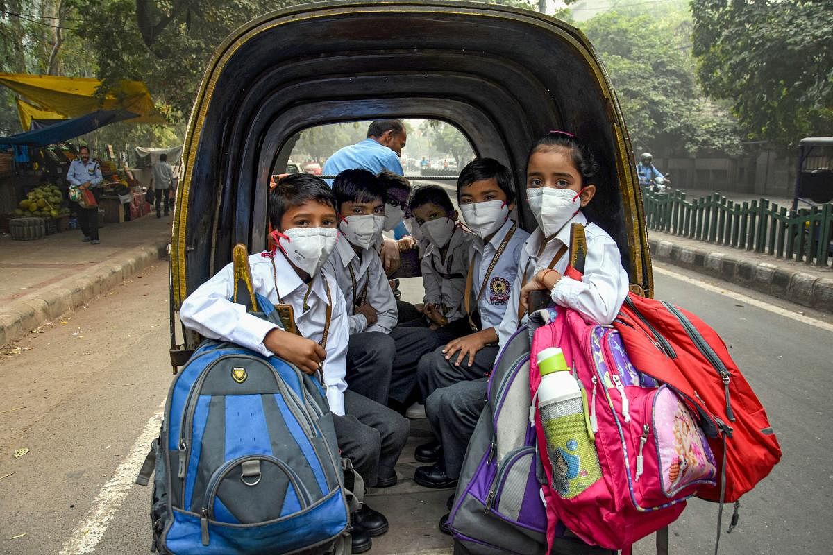 Students wear masks to tackle air pollution in New Delhi. (PTI Photo)