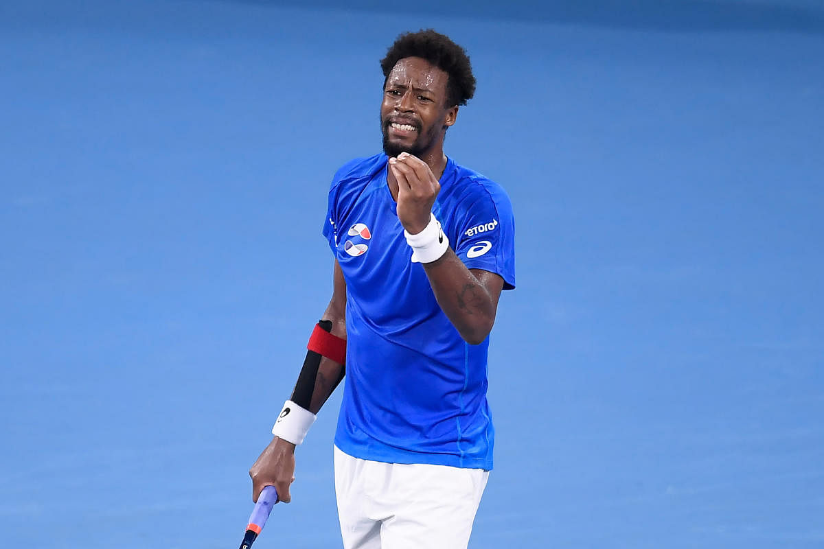 Gael Monfils of France reacts during his match against Novak Djokovic of Serbia during day 4 of the ATP Cup tennis tournament at Pat Rafter Arena in Brisbane, Australia. (AAP Photo)