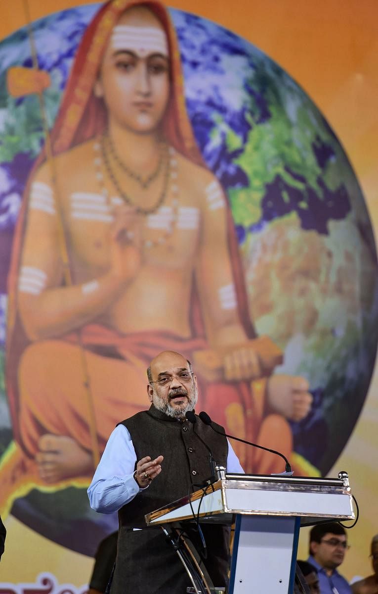 Union Home Minister Amit Shah with Karnataka Chief Minister B S Yediyurappa at Vivekadeepini Mahasamarpane (chanting of Vivekadeepini), organised by Vedanta Bharati at Palace Grounds in Bengaluru, Saturday, Jan. 18, 2020. (PTI Photo)