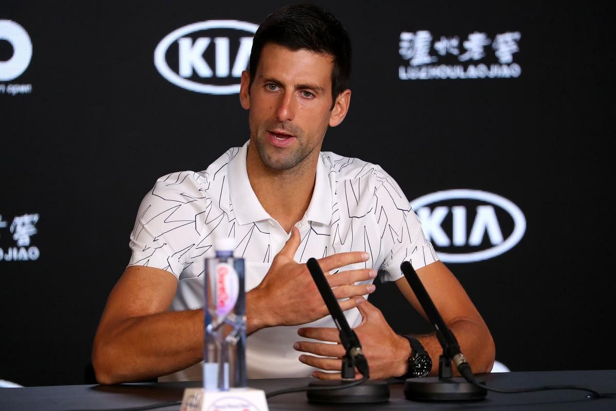 erbia's Novak Djokovic speaks during a press conference ahead of the Australian Open tennis tournament in Melbourne. AFP