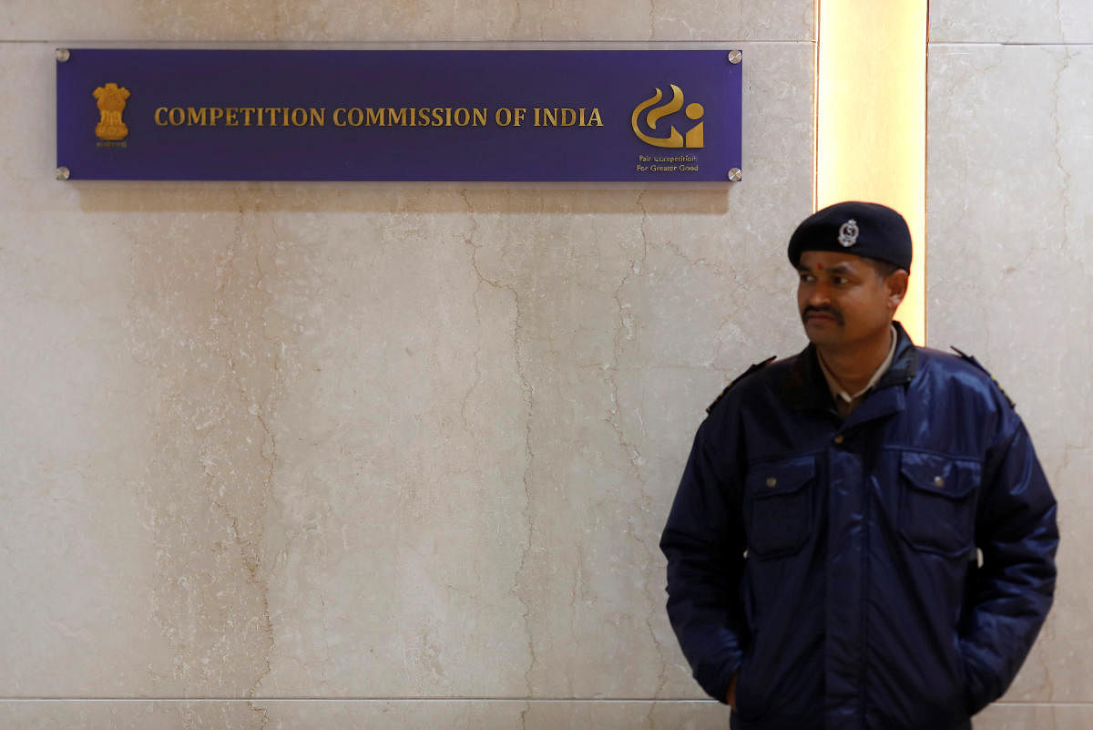 A security guard stands outside the Competition Commission of India (CCI) headquarters in New Delhi. (REUTERS photo)
