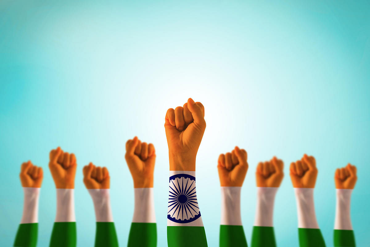 India national flag pattern on leader's fist isolated (clipping path) on blue mint sky for Human equal rights, labor day conceptndia national flag pattern on leader's fist isolated (clipping path) on blue mint sky for Human equal rights, labor day concep