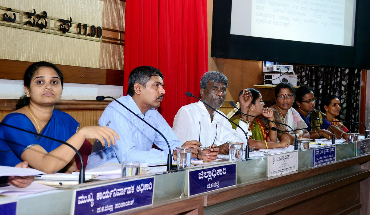 District In-charge Minister Kota Srinivas Poojary chairs quarterly KDP review meeting at ZP hall in Mangaluru on Monday. DH Photo