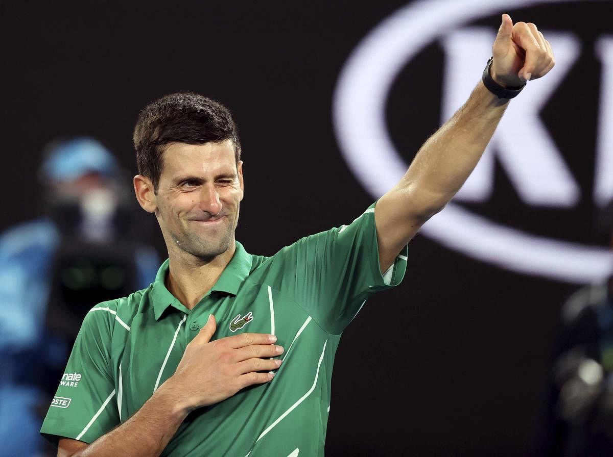 Serbia's Novak Djokovic celebrates after defeating Germany's Jan-Lennard Struff in their first round singles match the Australian Open tennis championship in Melbourne. AP/PTI