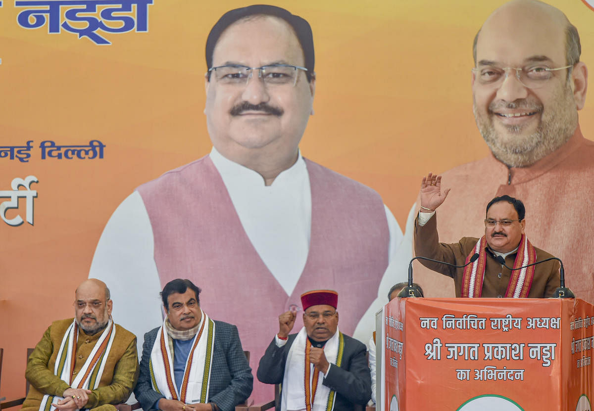  Newly elected BJP National President Jagat Prakash Nadda (R) addresses a felicitation function organised for him, at the party headquarters, in New Delhi. (PTI Photo)