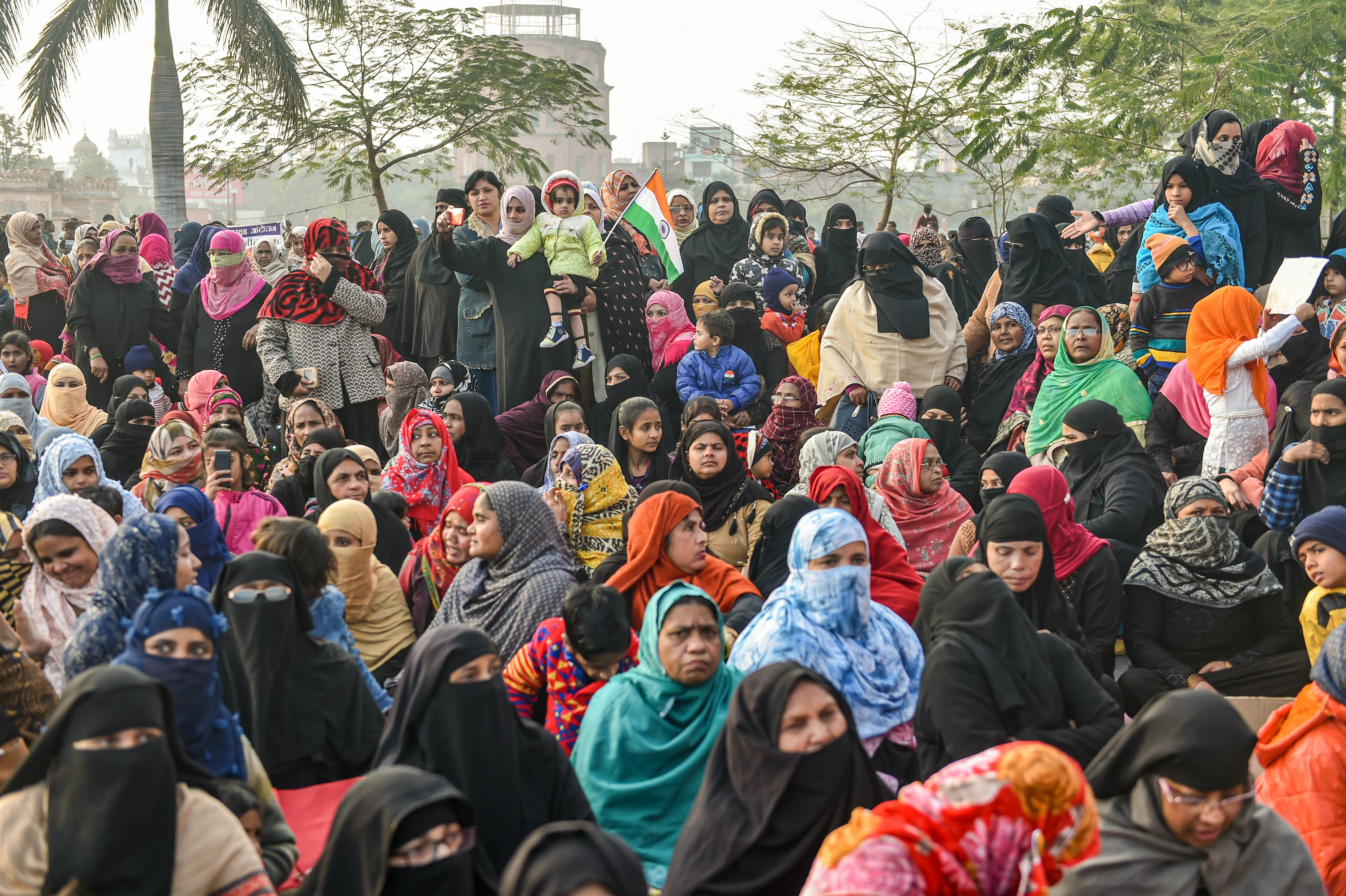  Muslim women along with children stage a protest against CAA and NRC near Ghantaghar in old city area of Lucknow, Monday, Jan. 20, 2020. (PTI Photo)