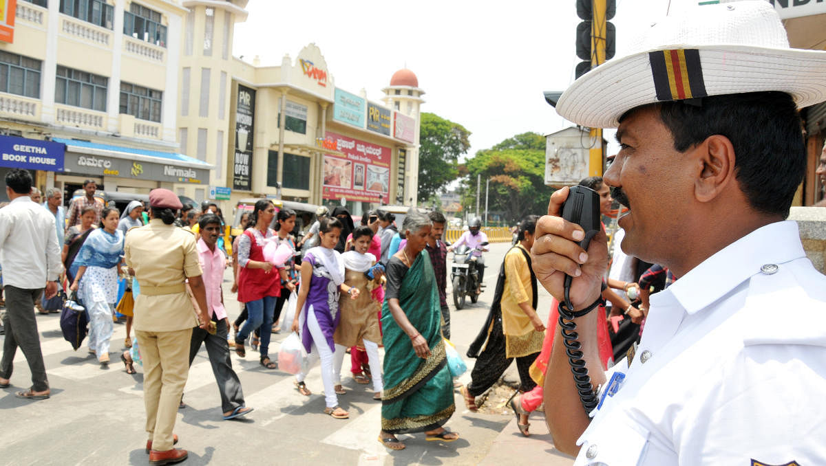 Traffic police personnel using the public address system to regulate traffic. dh-file photo
