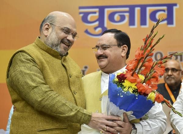 Union Home Minister and outgoing BJP President Amit Shah greets party leader J P Nadda after he was elected as the next national President of the party, in New Delhi, Monday, Jan. 20, 2020. (PTI Photo)