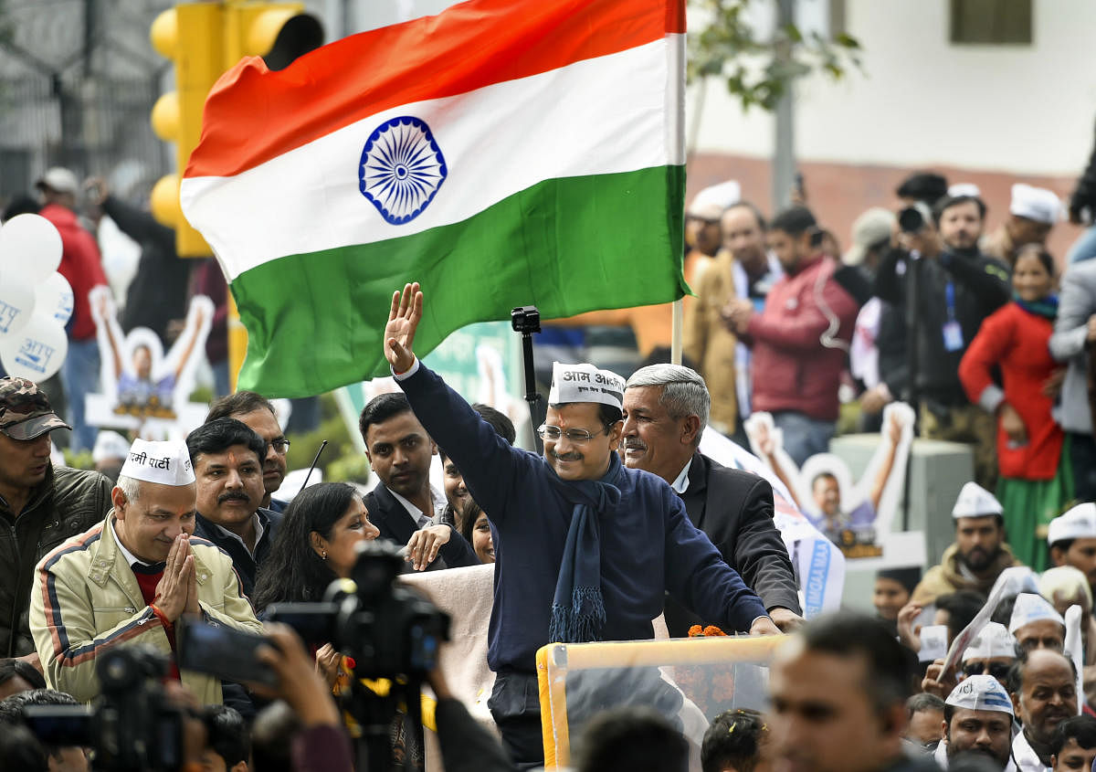 AAP convenor and Delhi Chief Minister Arvind Kejriwal (C) during a roadshow before filing his nomination papers for the Assembly polls, in New Delhi, Monday, Jan. 20, 2020. Delhi Deputy CM Manish Sisodia (L) is also seen. (PTI Photo)