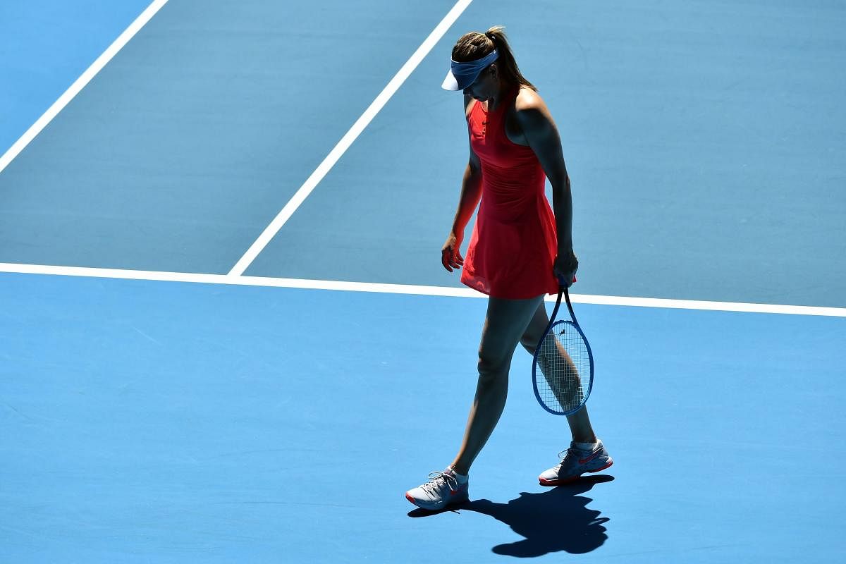 Russia's Maria Sharapova reacts on a point against Croatia's Donna Vekic during their women's singles match on day two of the Australian Open tennis tournament in Melbourne. (AFP PHOTO)