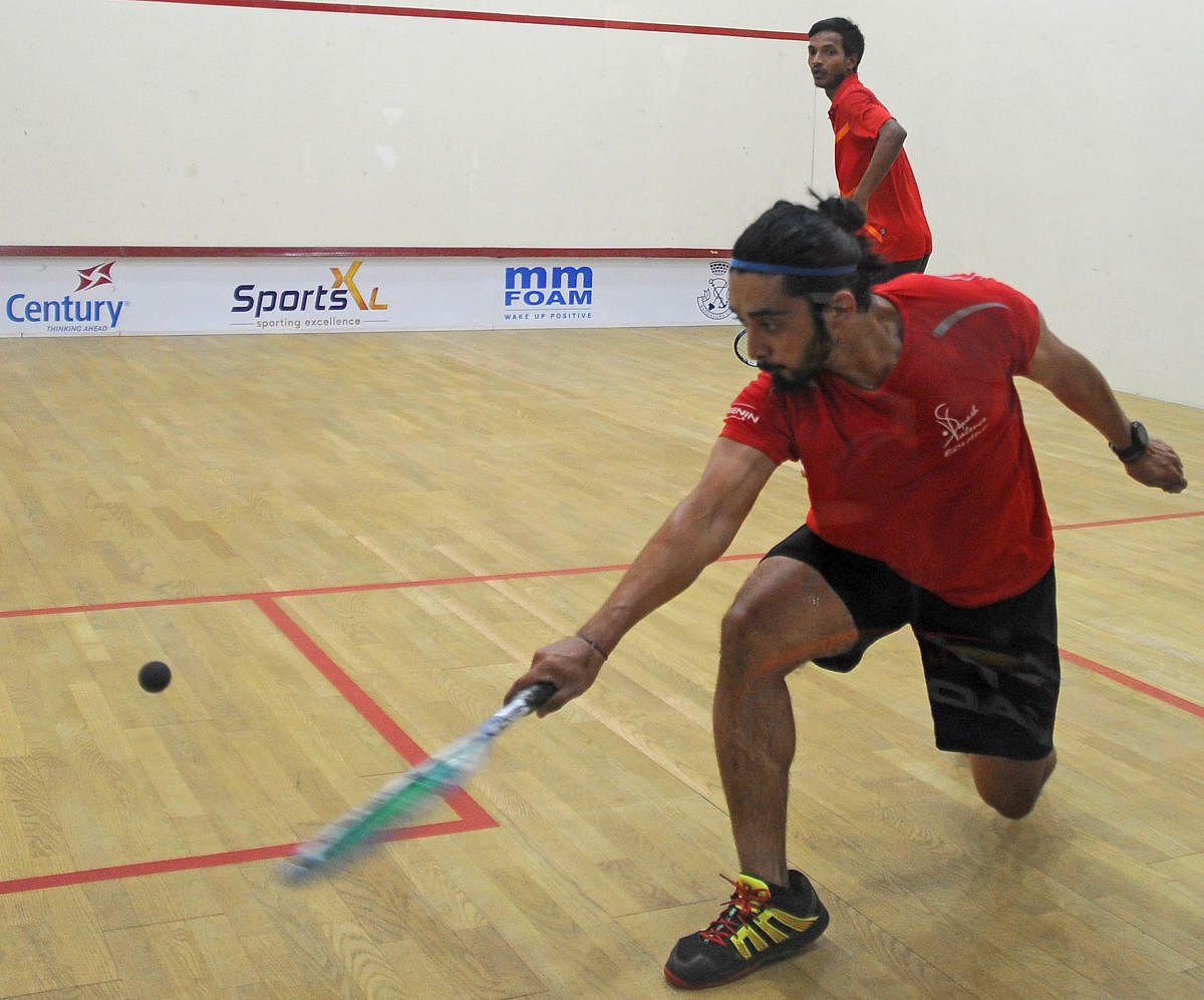 Abhishek Pradhan returns during his semifinal win over Ranjit Singh in the Century Bangalore Squash Open at the Bangalore Club on Tuesday. DH PHOTO/PUSHKAR V