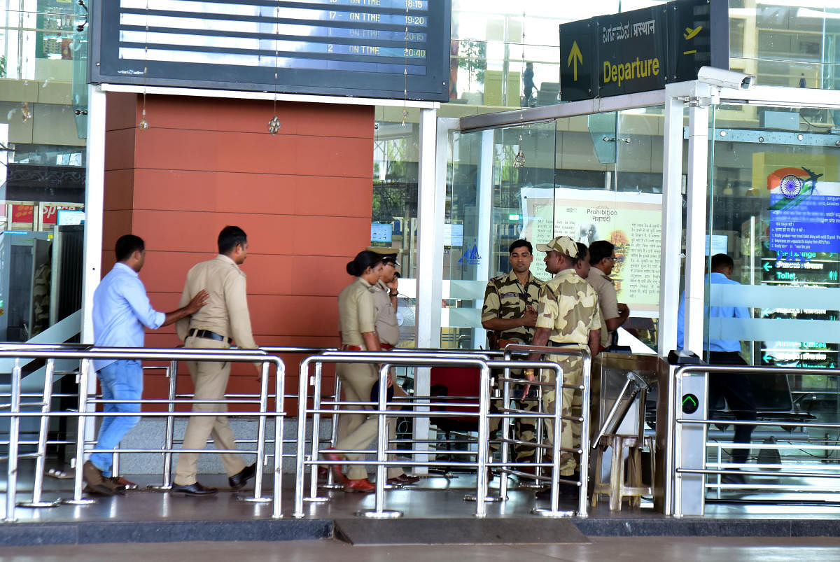 CISF and police personnel at the departure gate of Mangaluru airport a day after an IED was found at the counter.