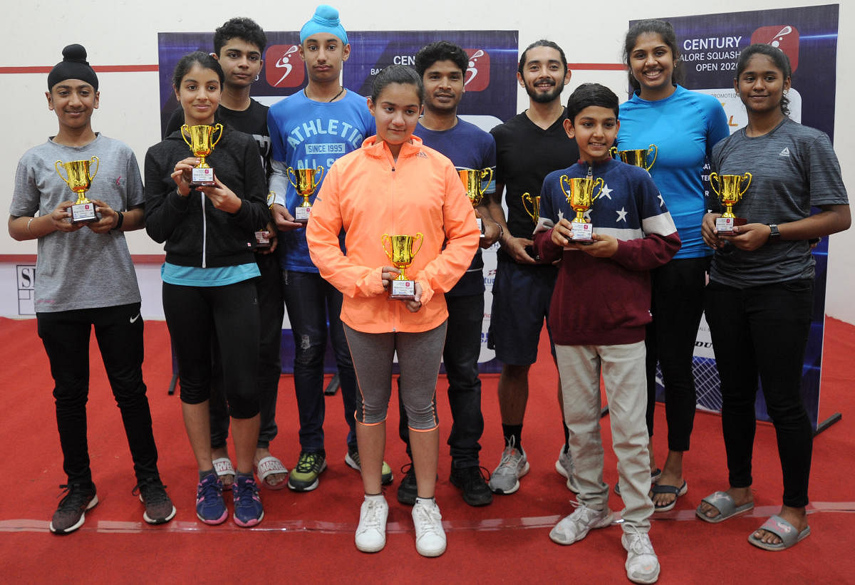 Winners of the Sports XL Century Bangalore Squash Open at the Bangalore Club. From left: Gurveer Singh (boys, U-13), Diya Yadav (girls, U-13), Rutva Samant (boys, U-17), Tavneet Singh Mundra (boys, U-15), Vyomika Khandelwal (girls, U-11) Sanjay Pawar (men over 35), Abhishek Pradhan (men), Darshil Parasrampuria (boys, U-11), Aparajitha Balamurukan (women), Deepika V (girls, U-15). DH PHOTO