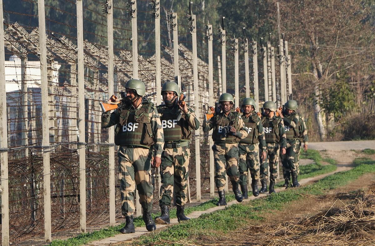Border Security Force (BSF) soldiers patrol along the India-Pakistan border, ahead of Republic Day 2020 at RS Pura about 35 km from Jammu, Thursday, Jan. 23, 2020. Credit: PTI Photo