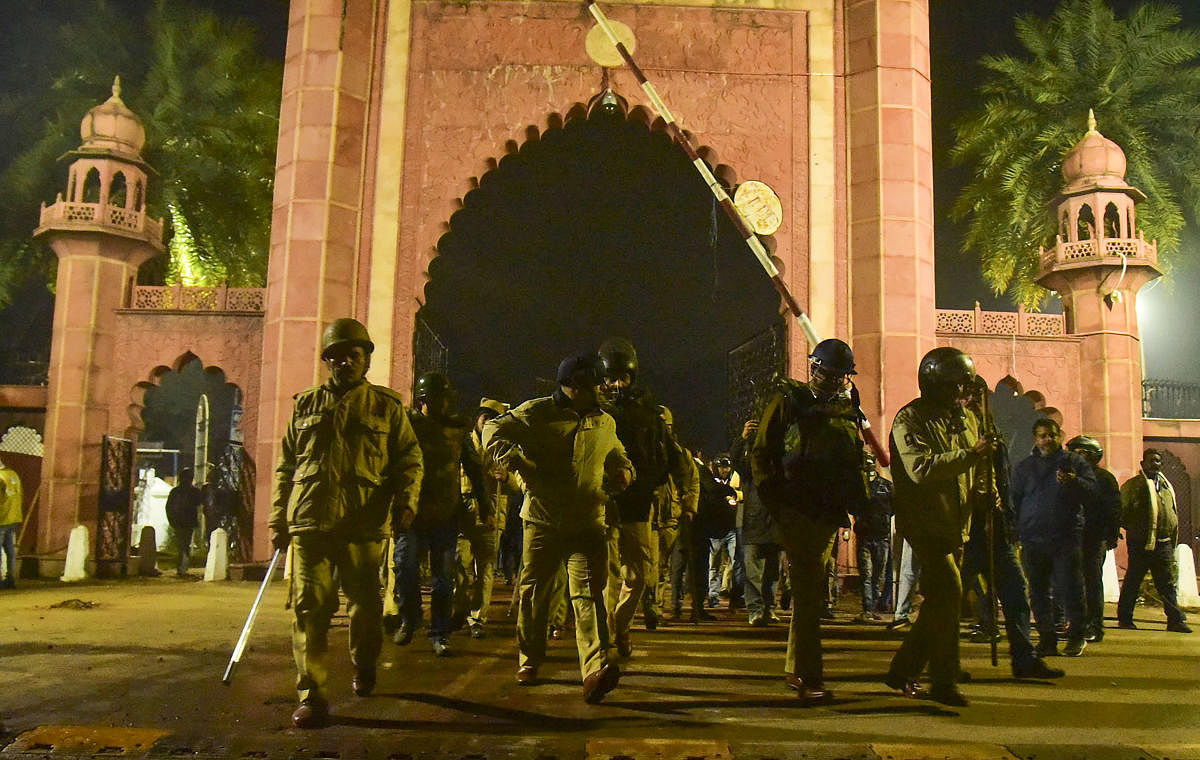Police perssonnel after clashes following protests over Citizenship Amendment Act, on the campus of Aligarh Muslim University (AMU), in Aligarh on Dec. 15, 2019. (PTI Photo)