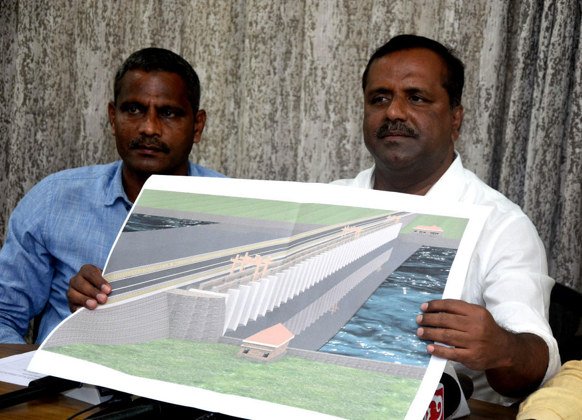 MLA U T Khader releases a sketch of the bridge-cum-barrage to be constructed from Harekala Kadavu to Adyar.