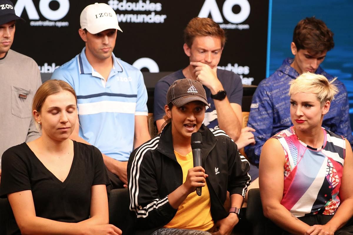 Sania Mirza (C) of India with Ukraine's Nadiia Kichenok (L) and Bethanie Mattek-Sands of the US attend a press conference ahead of the Australian Open tennis tournament in Melbourne on January 19, 2020. AFP