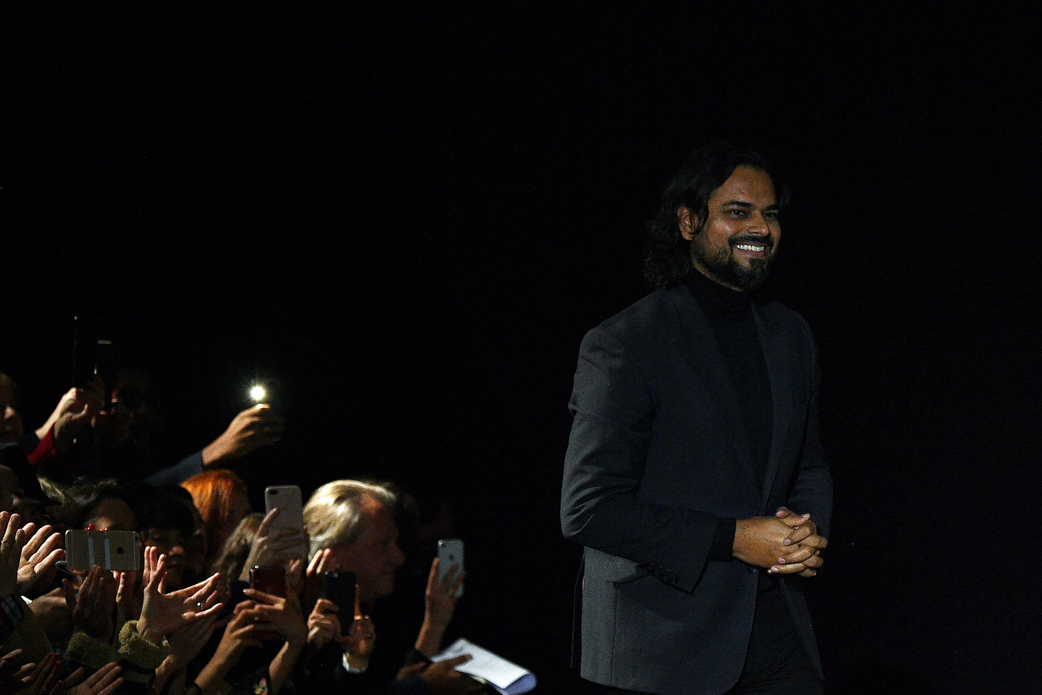 Indian fashion designer Rahul Mishra acknowledges the audience at the end of the Women's Spring-Summer 2020 Haute Couture collection fashion show in Paris. (AFP Photo)