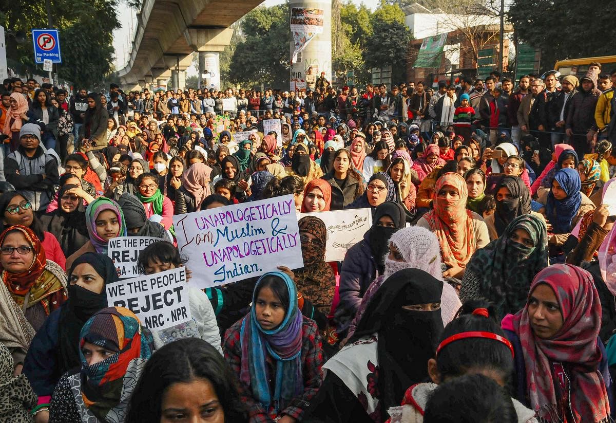 Protestors during a rally against Citizenship Amendment Act (CAA), outside the Jamia Millia Islamia University. (PTI Photo)