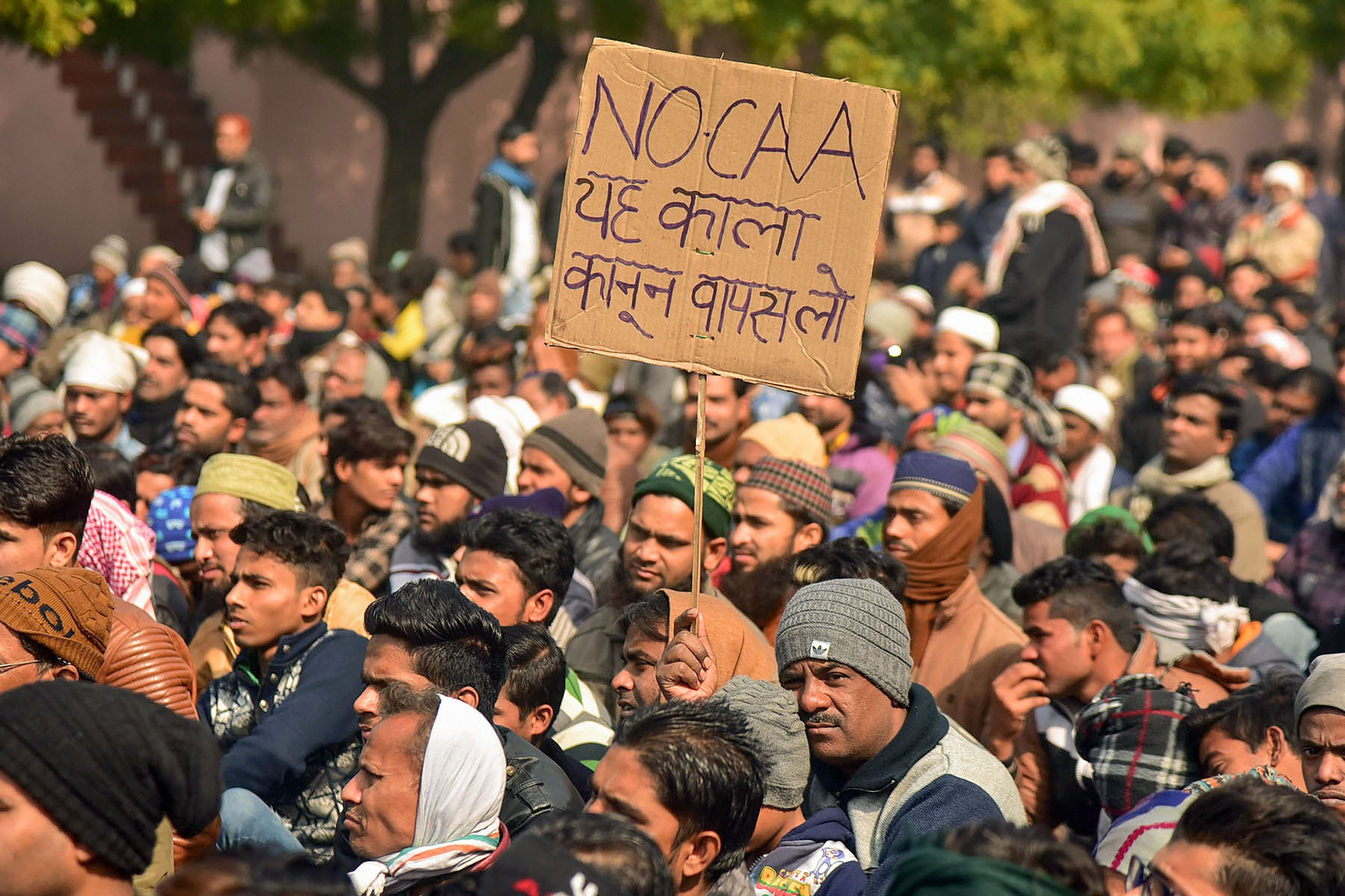  Protestors participate in a demonstration against CAA and NRC at Shahjamal Eidgah in Aligarh, Wednesday, Jan. 22, 2020. (PTI Photo)