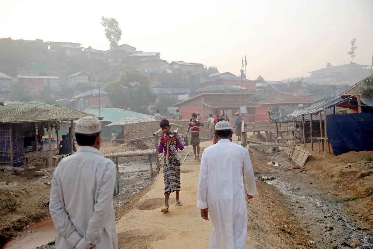 Rohingya refugees walk on a road at the Balukhali camp. (Reuters photo)