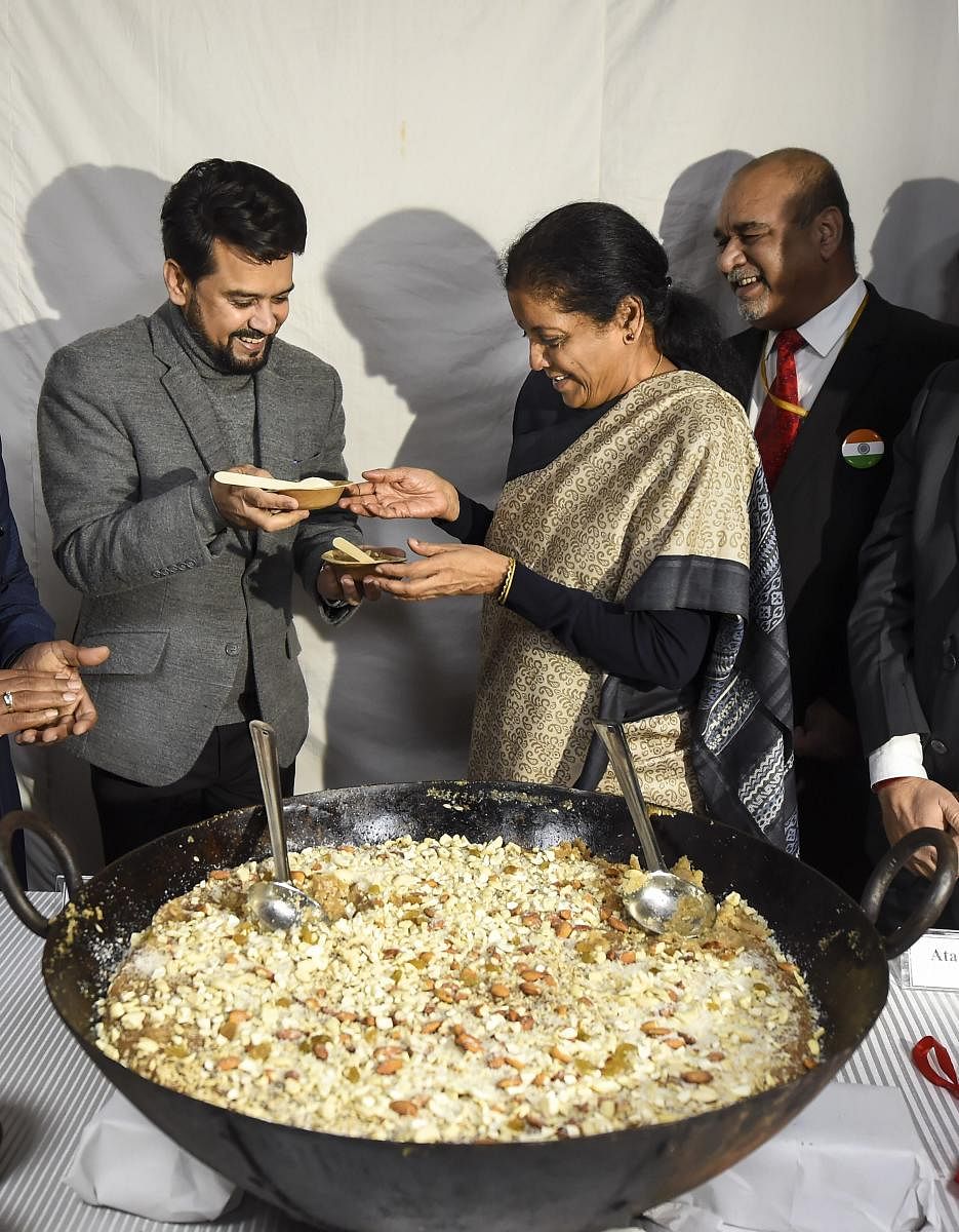 Finance Minister Nirmala Sitharaman(R) and Minister of State for Finance Anurag Singh Thakur(L) during 'Halwa' ceremony marking the commencement of Budget printing process for the General Budget 2019-20, in New Delhi, Monday, Jan. 20, 2020. (PTI Photo)