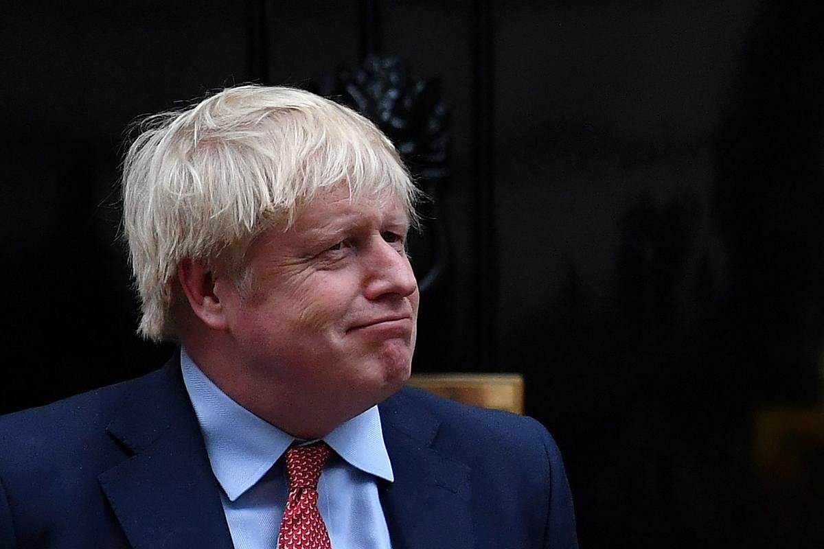 British Prime Minister Boris Johnson signed Britain's EU divorce agreement on Friday. (Photo by AFP)