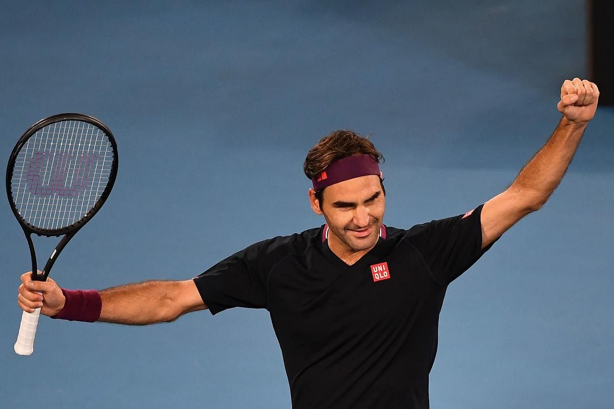 Switzerland's Roger Federer celebrates after victory against Australia's John Millman during their men's singles match on day five of the Australian Open tennis tournament in Melbourne on January 24, 2020. (AFP Photo)