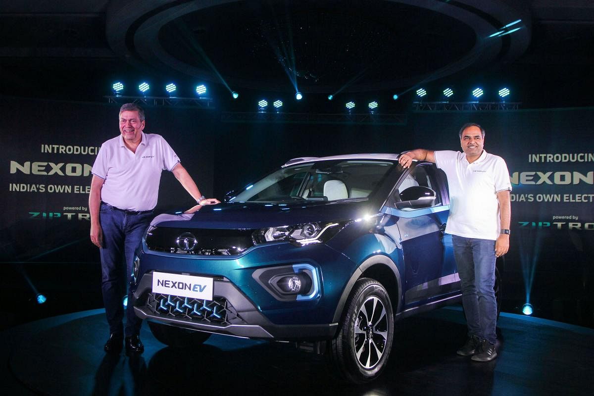 Tata Motors CEO and MD Guenter Butschek and Shailesh Chandra, President of Electric Mobility Business and Corporate Strategy at Tata Motors, unveil Nexon EV Electric SUV, in Mumbai, Thursday, Dec. 19, 2019. (PTI Photo)