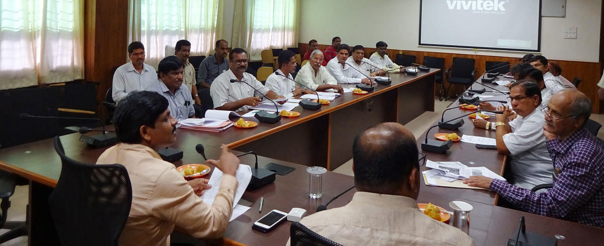 Deputy Commissioner G Jagadeesha chairs a meeting at his ofice in Manipal on Friday.