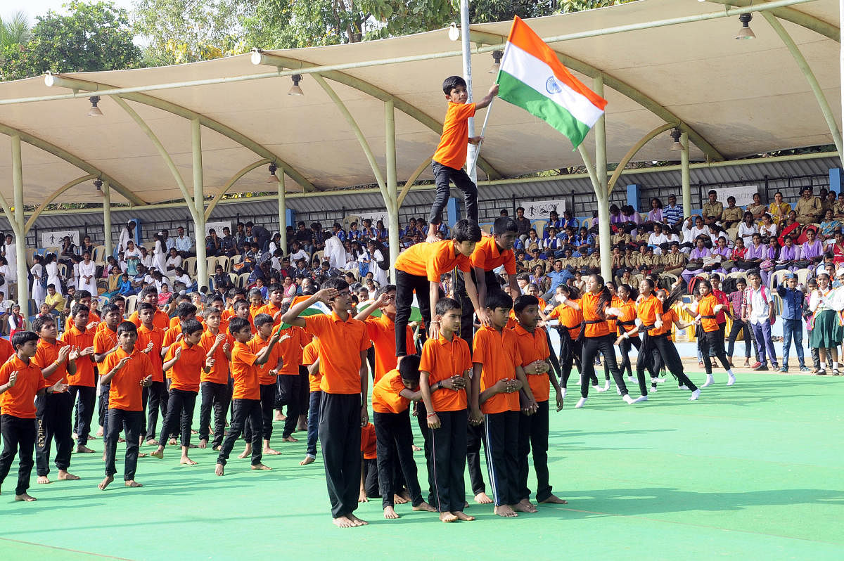 Students present a cultural programme during the 71st Republic Day celebrations at Ajjarakadu district stadium in Udupi on Sunday.