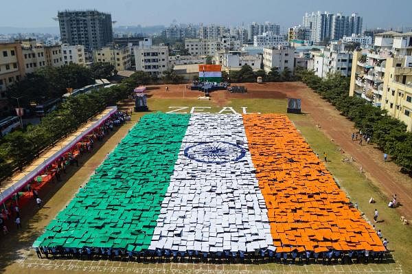  Around 4000 students from Zeal Education Society hold placards to form a huge Indian national flag, in Pune, Maharashtra, Saturday, Jan. 25, 2020. (PTI Photo) 