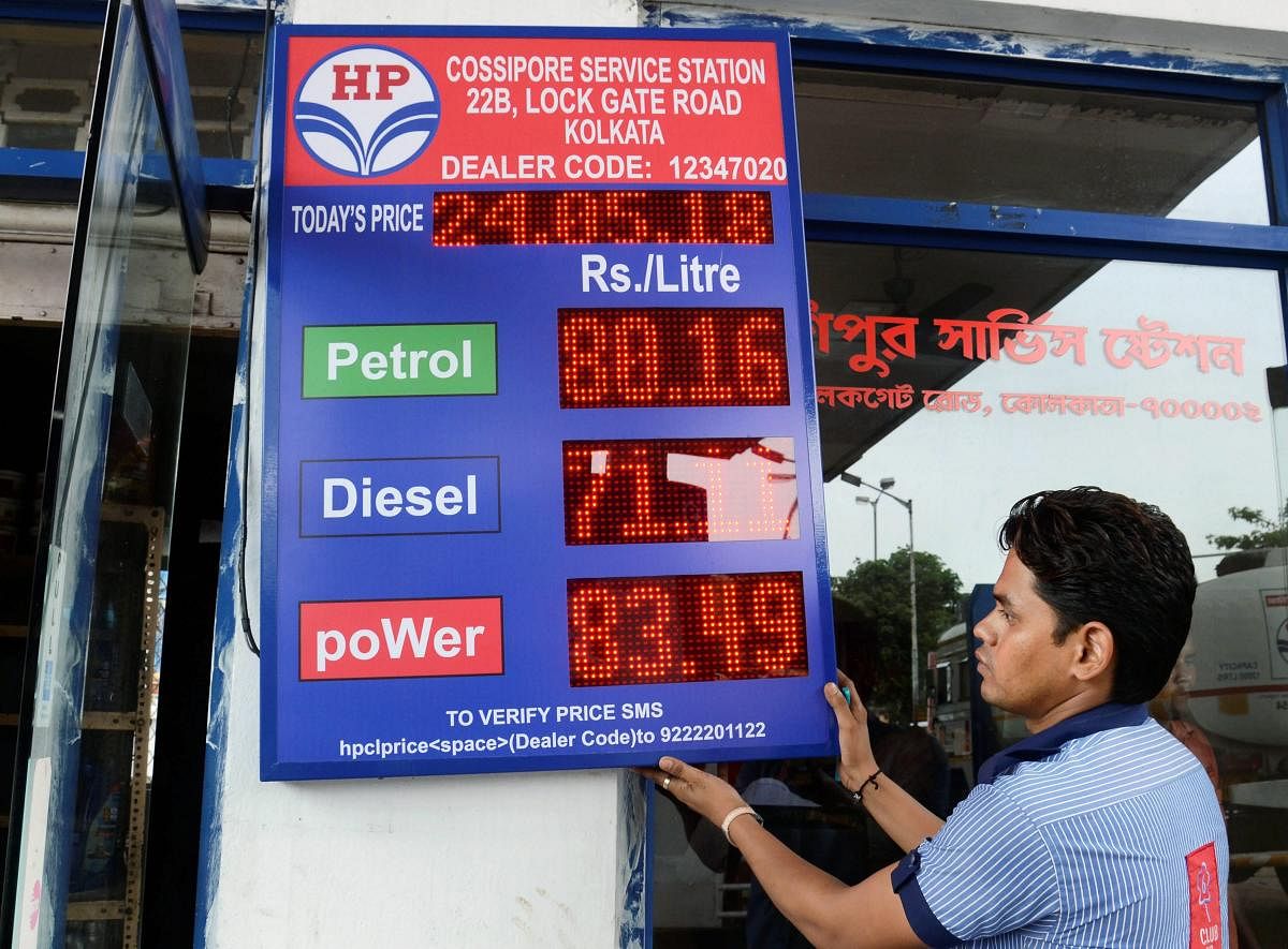 At present, the Centre charges an excise duty of Rs 17.98 per litre on petrol, while VAT levied by states is Rs 14.98. The overall price charged from dealers amounts to Rs 32.96 per litre. (PTI Photo)