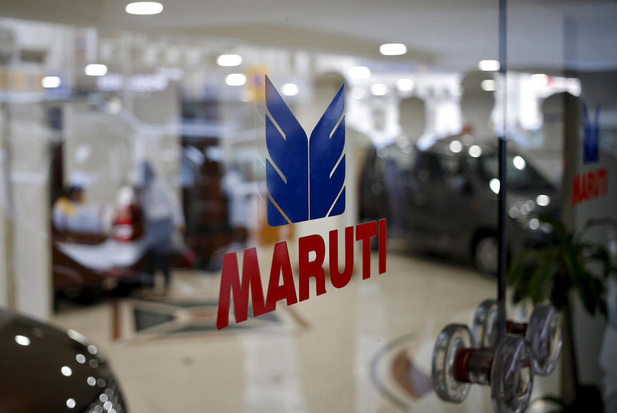 The logo of Maruti Suzuki India Limited is seen on a glass door at a showroom in New Delhi, India. (Credit: Reuters Photo)