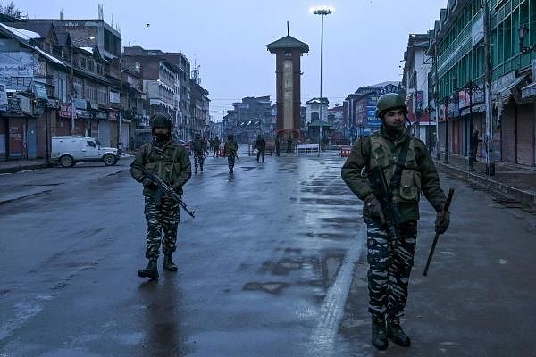 ecurity personnel patrol in Lal Chowk area during the Republic Day parade happening at Sher-i-Kashmir cricket Stadium in Srinagar on January 26, 2020. (AFP Photo)